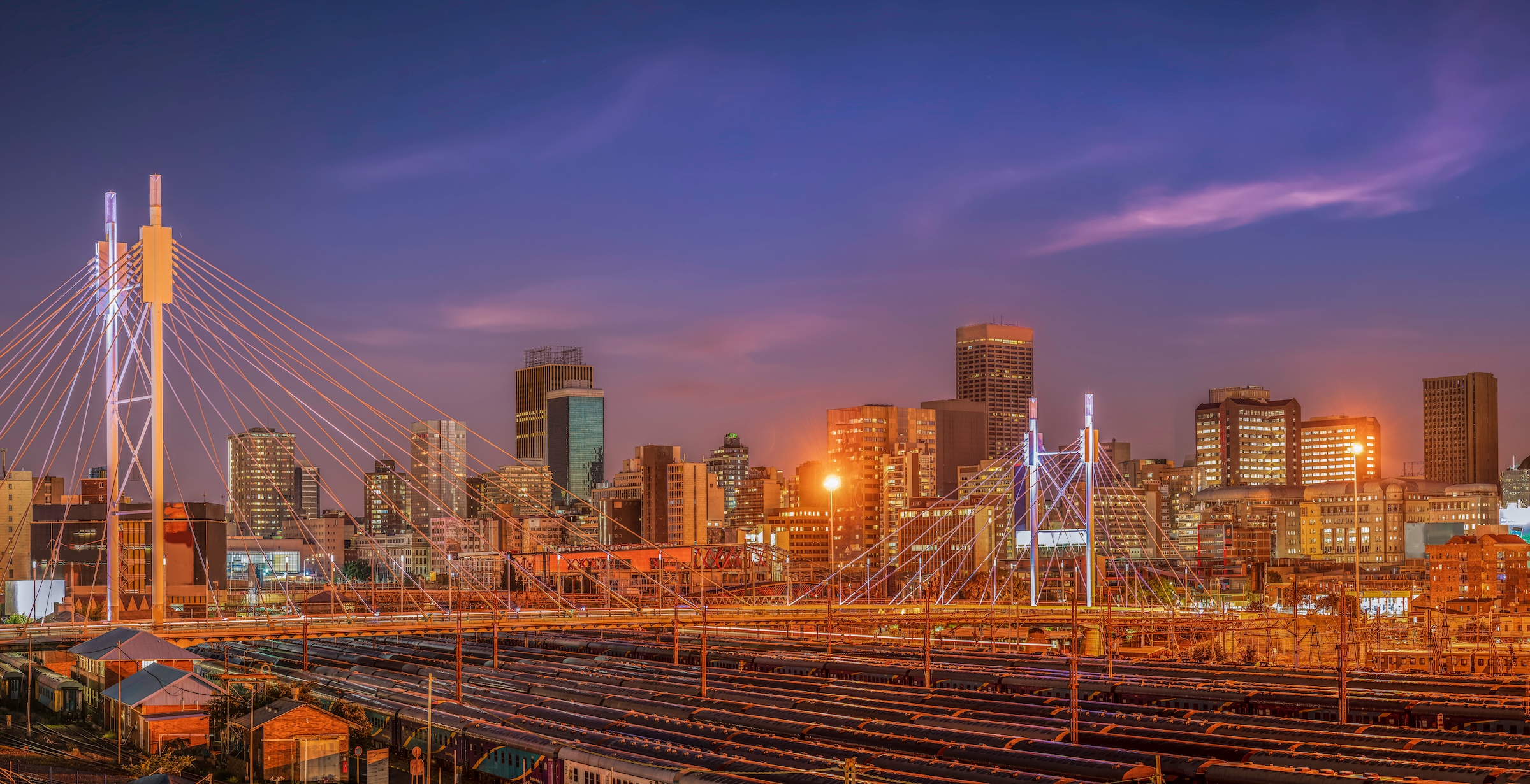 Nelson Mandela Bridge and Johannesburg city lit up at night