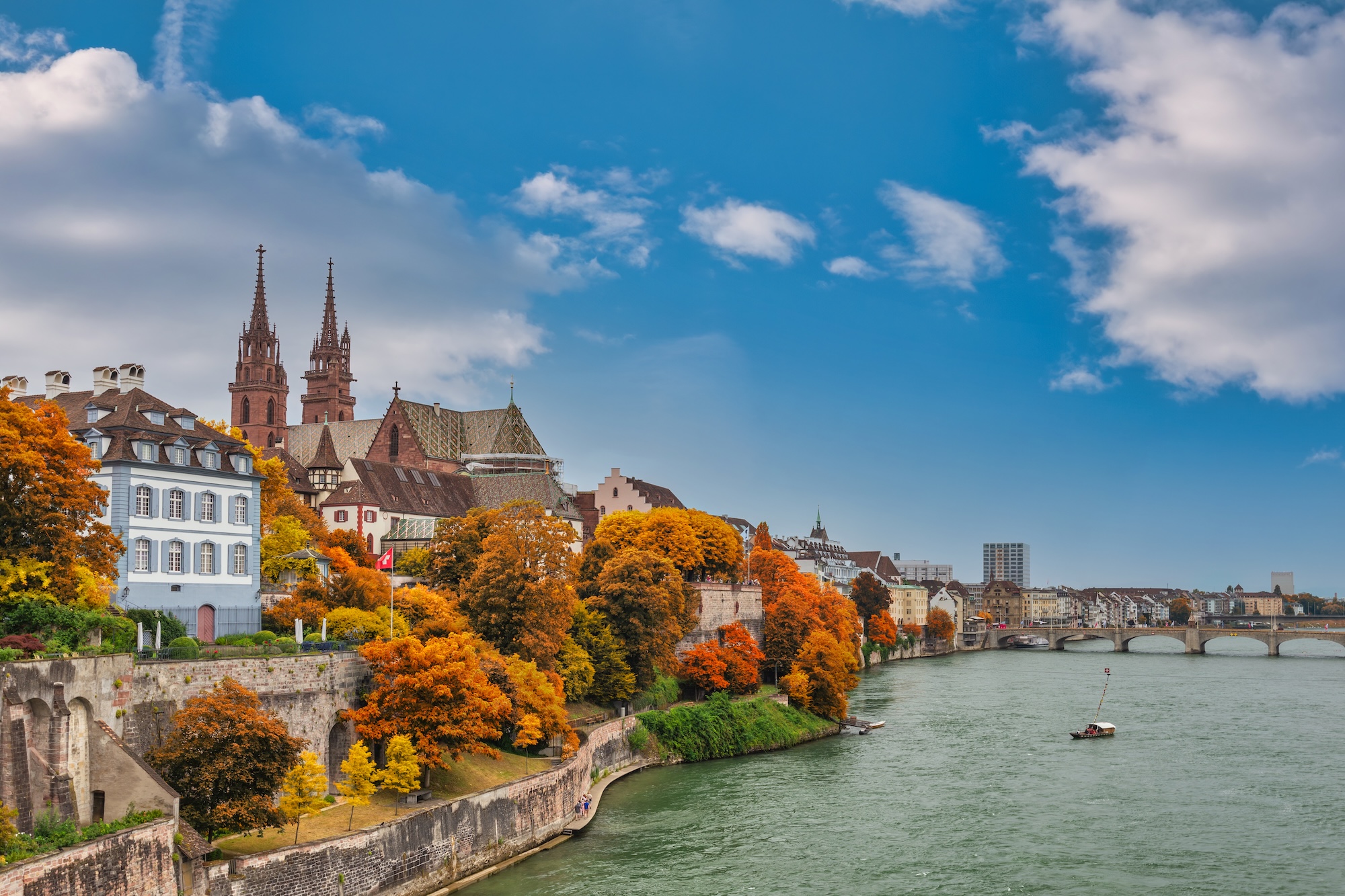 Basel Switzerland, city skyline at Rhine River with autumn foliage season